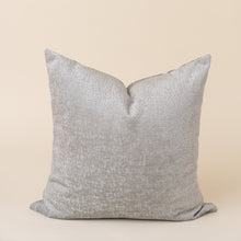 Load image into Gallery viewer, silver velvet pillow on tan background