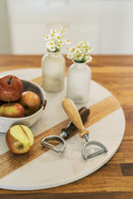 Load image into Gallery viewer, fruit peelers next to apples on table