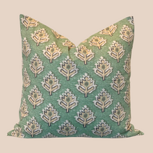 Load image into Gallery viewer, green leaf pattern pillow against tan background
