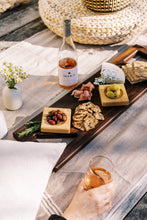 Load image into Gallery viewer, charcuterie plate and wine at outdoor picnic
