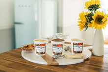 Load image into Gallery viewer, three ice cream pints with scoops and sunflowers
