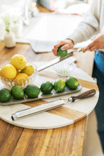 Load image into Gallery viewer, wood microplanes with woman zesting lime in background
