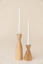 Load image into Gallery viewer, two white ash candleholders with white candles on tan background
